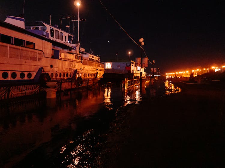 Ships In A Dock At Night 