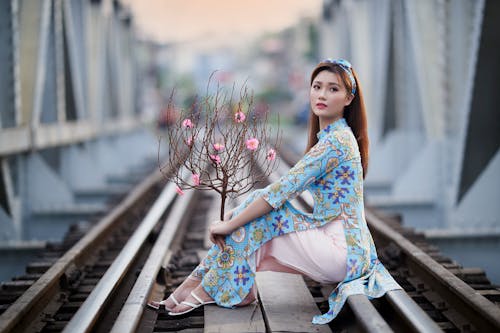 Beautiful Woman Having Photoshoot on Train Tracks
