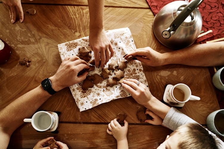 Overhead Shot Of People Getting Cookies At A Table