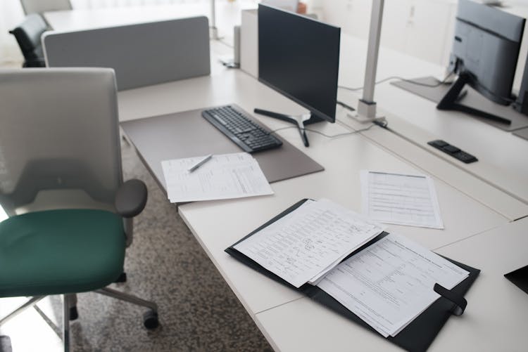 Documents In A Binder On A Work Desk