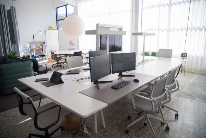 The Larkmoor studio floor, long shared desks under daylight — photo by Kampus Production on Pexels