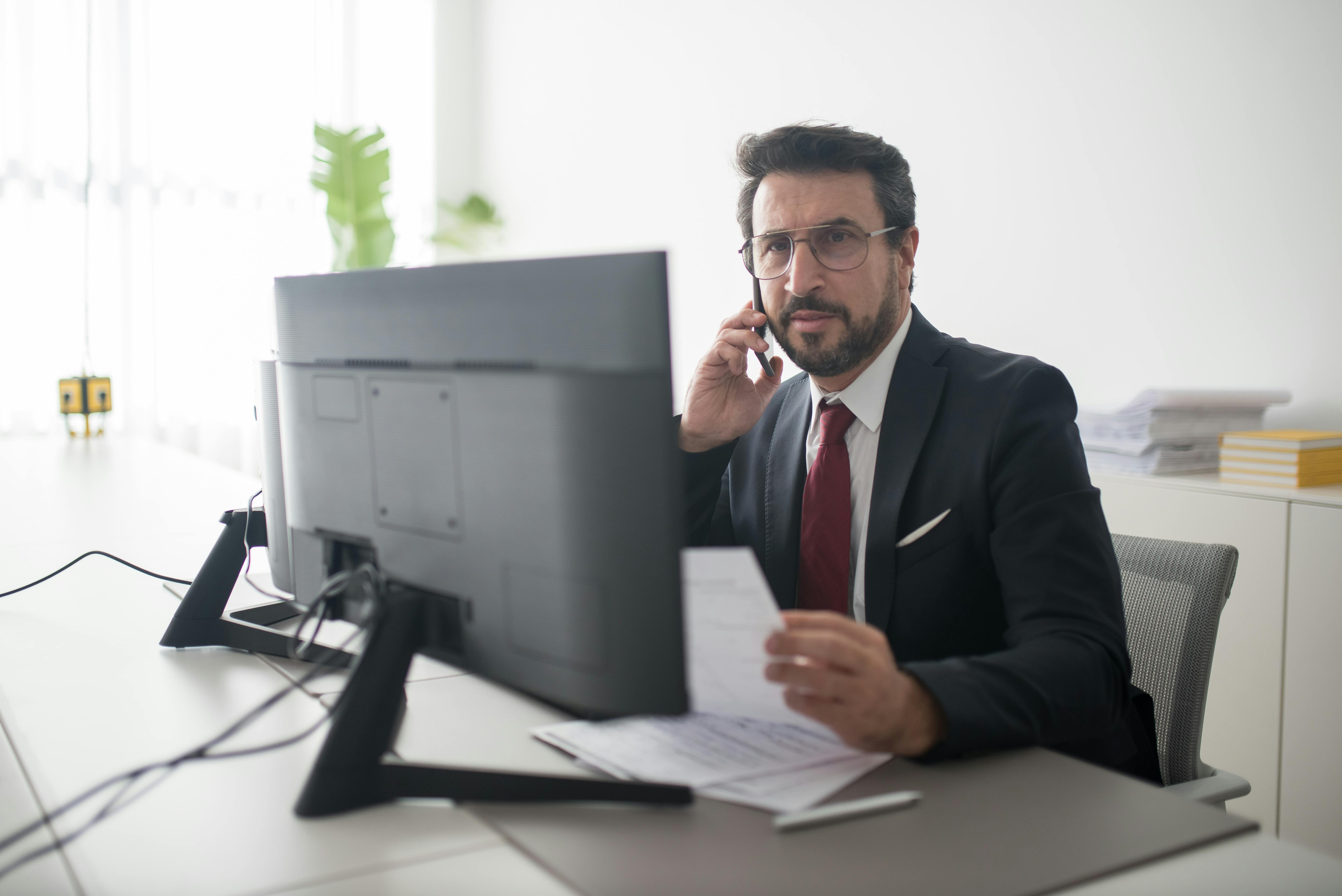 A split image showing a leader on the phone in an office at dawn and another leader reviewing documents with a coffee mug