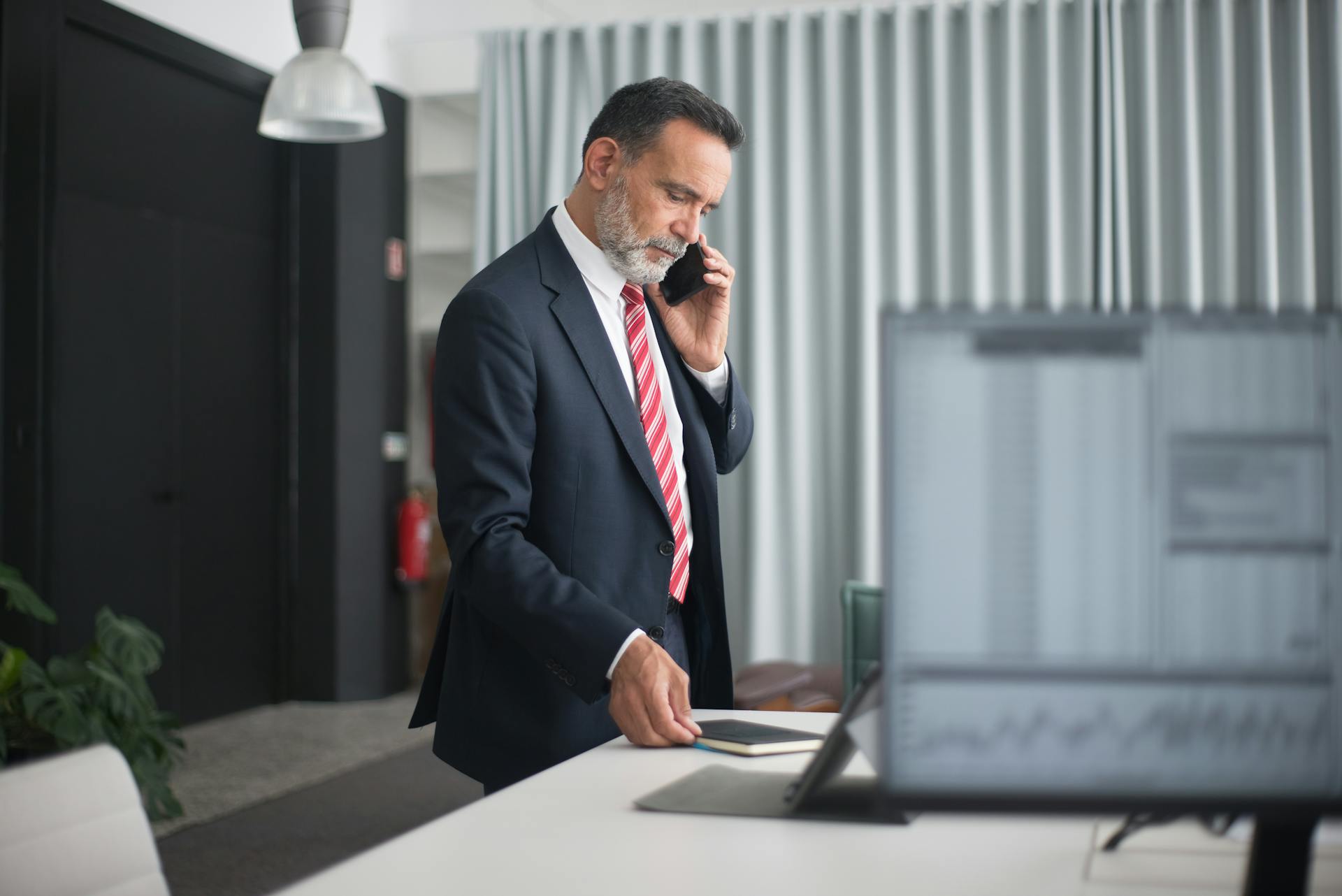 Man Wearing Black Suit in the Office