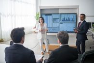 Man and Woman Presenting at Work