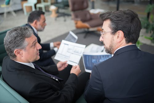 Free Men Having a Discussion at the Office Stock Photo