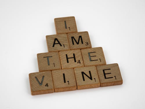 Wooden Scrabble Tiles on White Surface