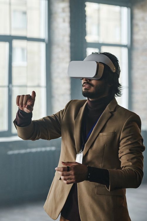 A Man in Brown Suit Wearing a Virtual Reality Headset · Free Stock Photo
