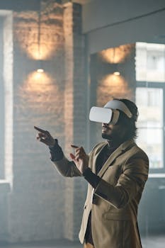 Adult male using a virtual reality headset in an industrial-style loft space.