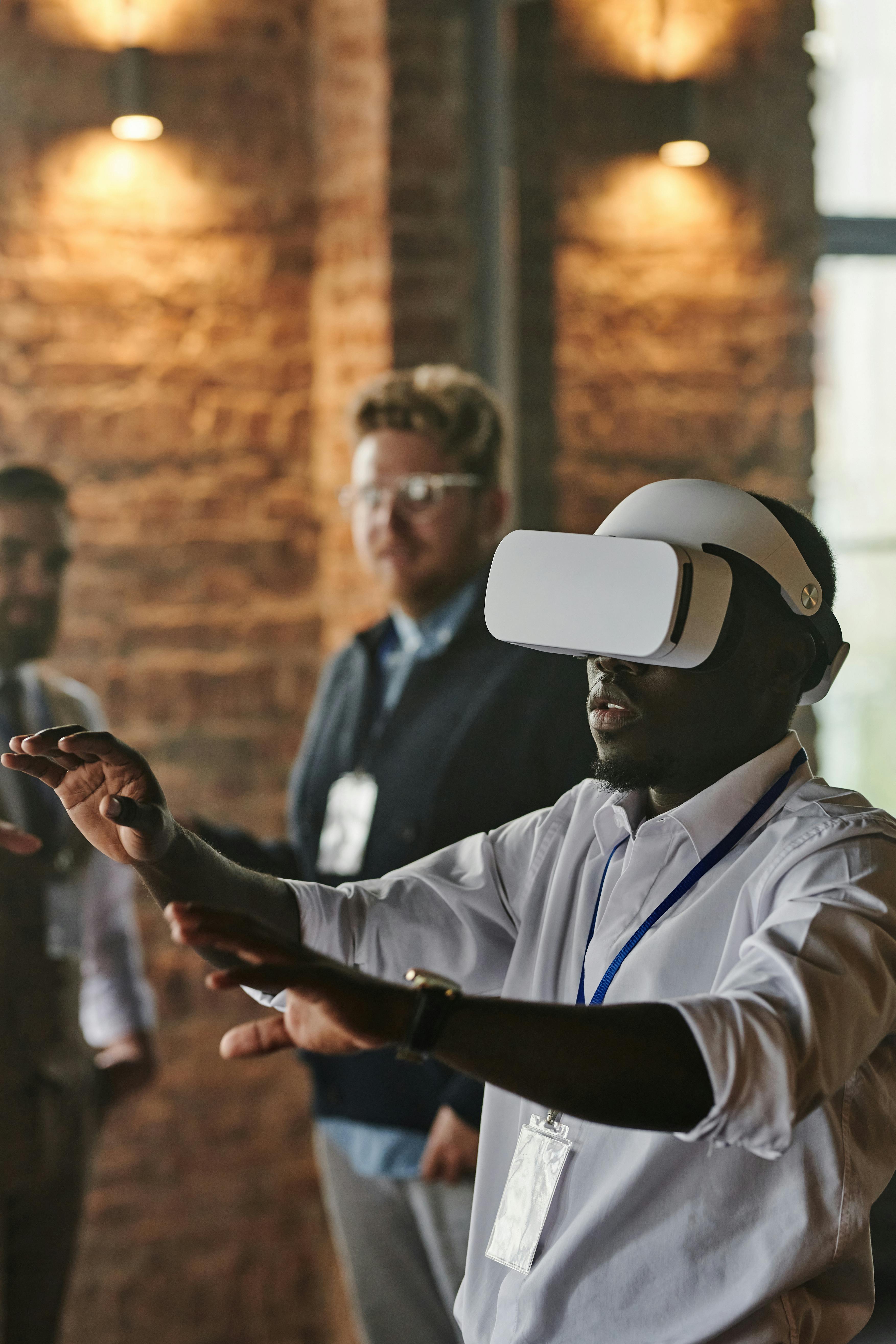 Man experiencing virtual reality with headset in office setting, engaging with technology.