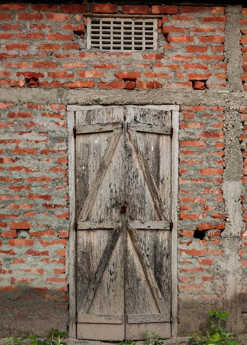 A  Wooden Door on a Brick Wall