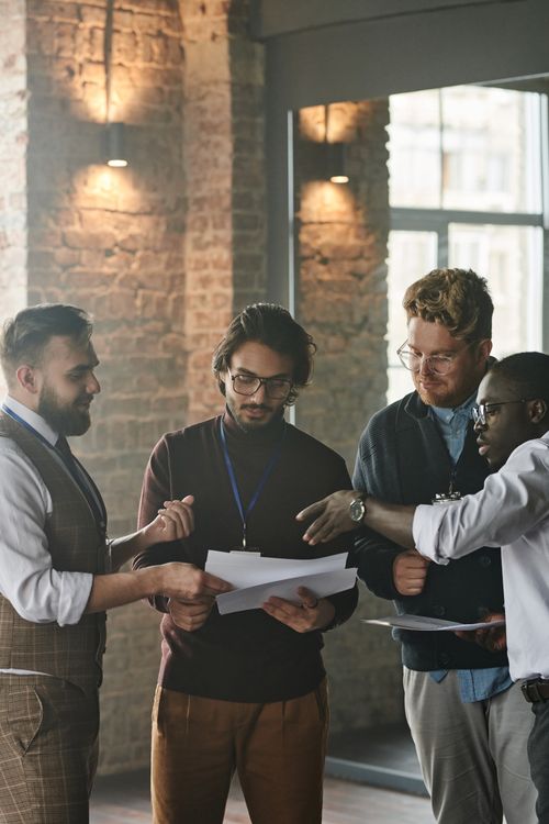 Free A diverse group of professionals working together on a project in a modern office space. Stock Photo