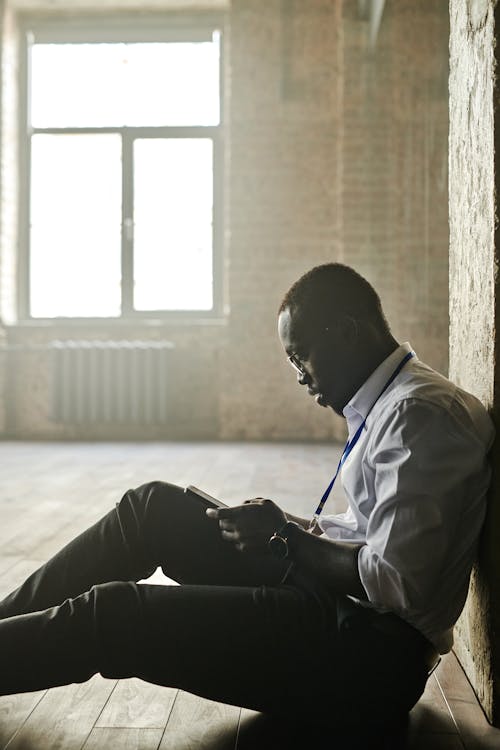 Man Sitting on the Floor 