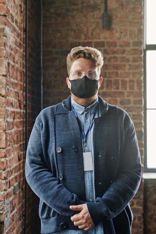 Man in Blue Jacket Wearing a Mask