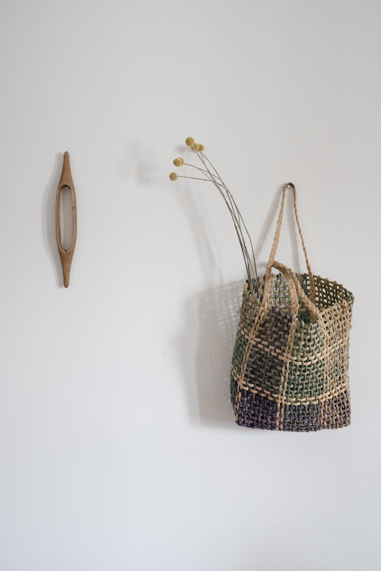 A Woven Bag Hanging On The Wall