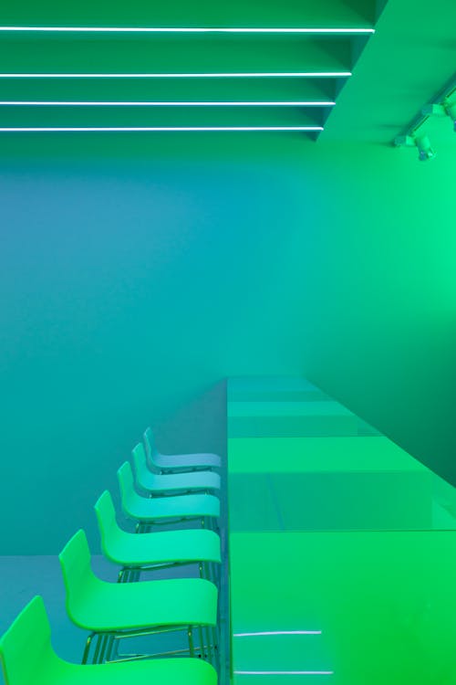 Photograph of a Tables and Chairs Near Green Lights