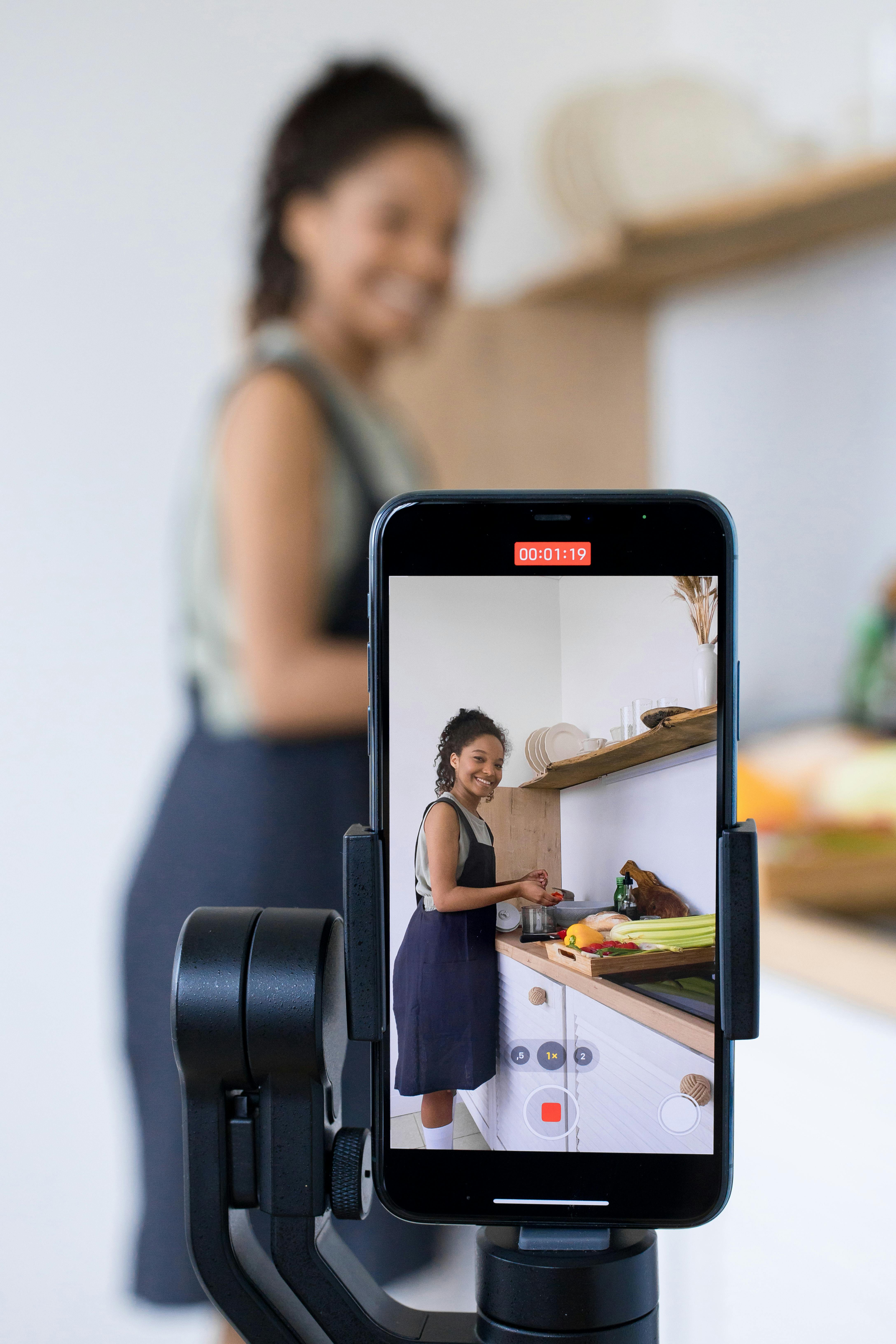 woman vlogging while preparing food in the kitchen