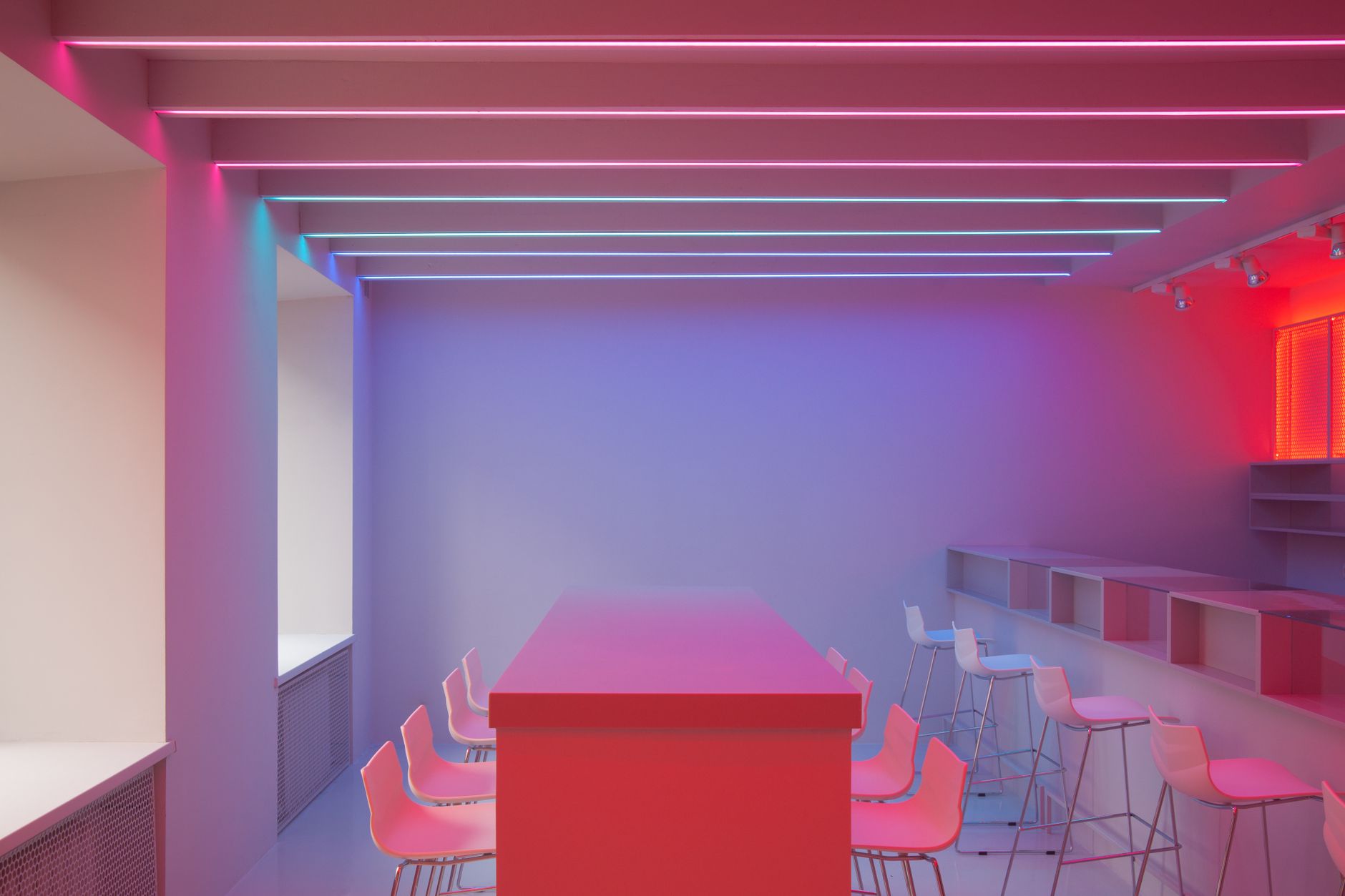 dim neon-lit dive bar interior with beer taps