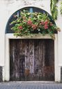 Red and Green Flower on Brown Wooden Door