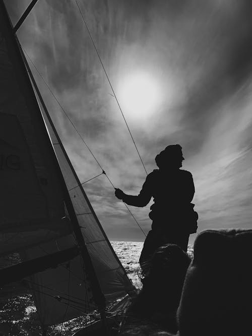 A man Riding a Sailboat