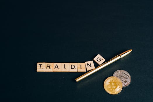 Bitcoin and trading concept shown with coins, pen, and letter tiles on a dark background.