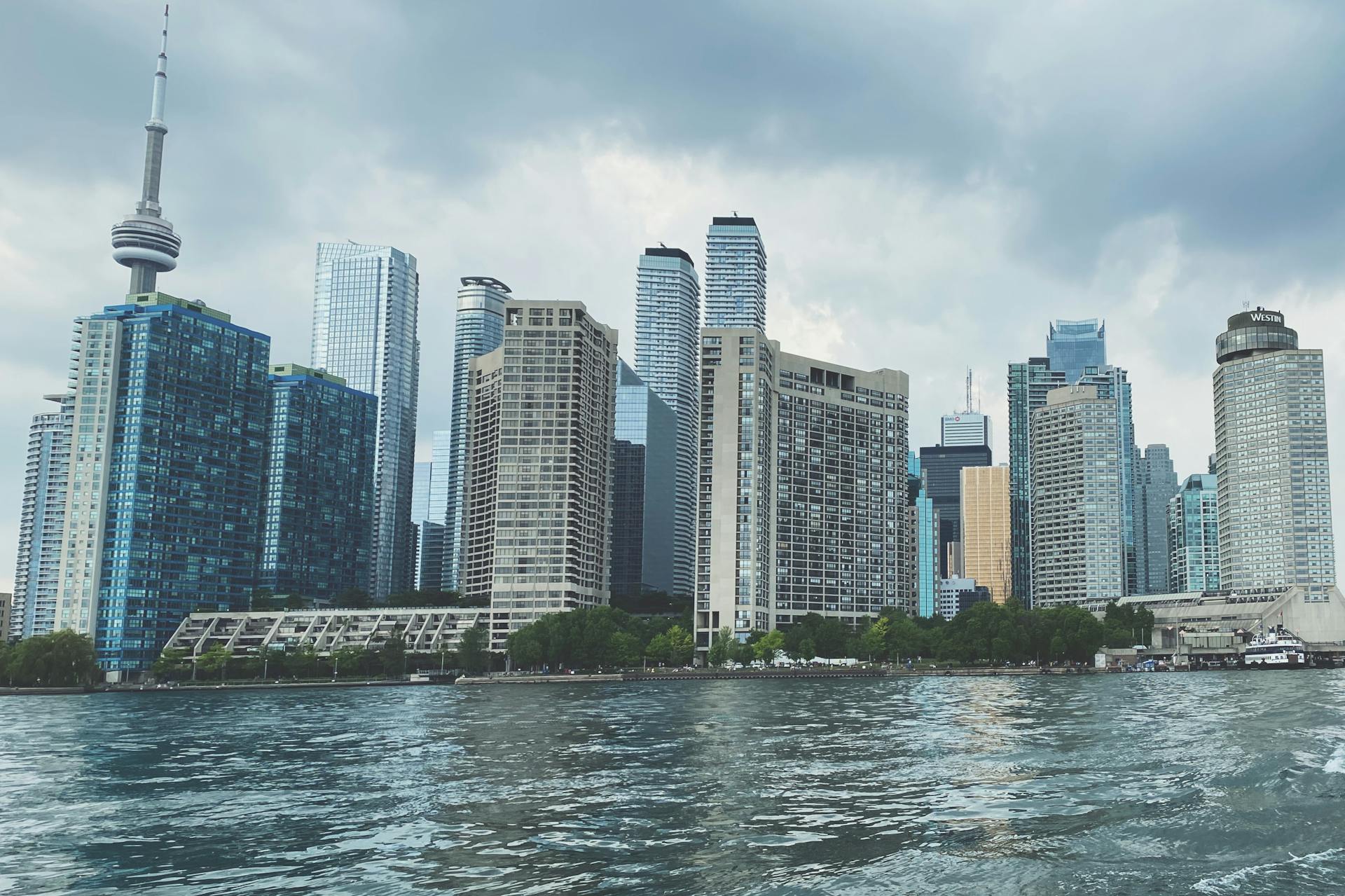 Stunning view of the Toronto skyline featuring the iconic CN Tower on a cloudy day.