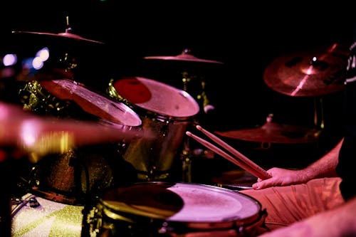 Free Man Playing Drums during Concert Stock Photo