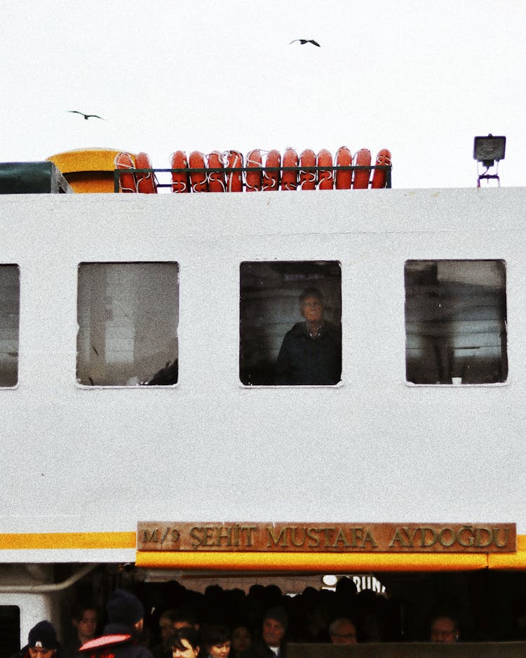 Man Behind A Window Of A Ship