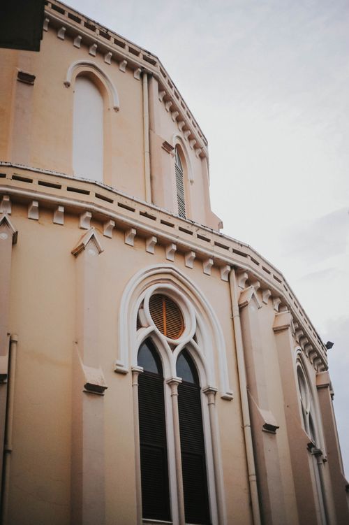 Free Low angle view of intricate Gothic cathedral facade in Ho Chi Minh City. Stock Photo