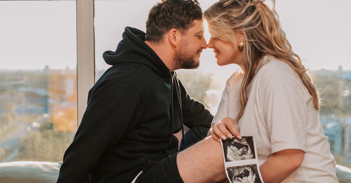 A pregnant woman receiving a reflexology foot massage during a spa treatment.