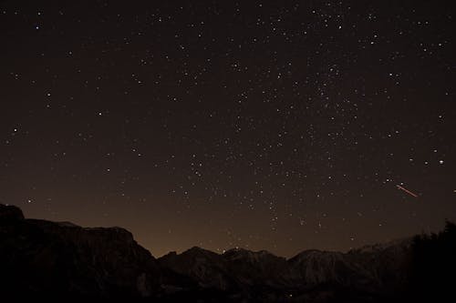 Free A Mountain Under the Starry Sky at Night Stock Photo