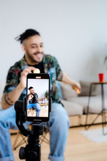 Engineer filming a handset test on a phone rig at home — photo by Ron Lach on Pexels