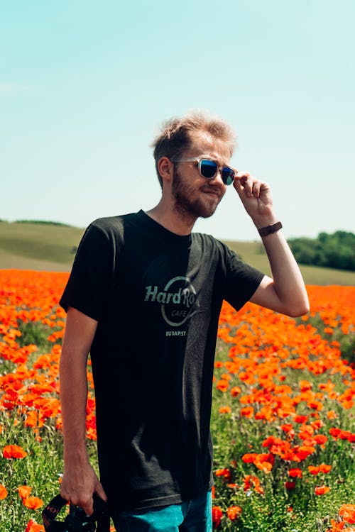 A Man on a Field of Poppy Flowers 