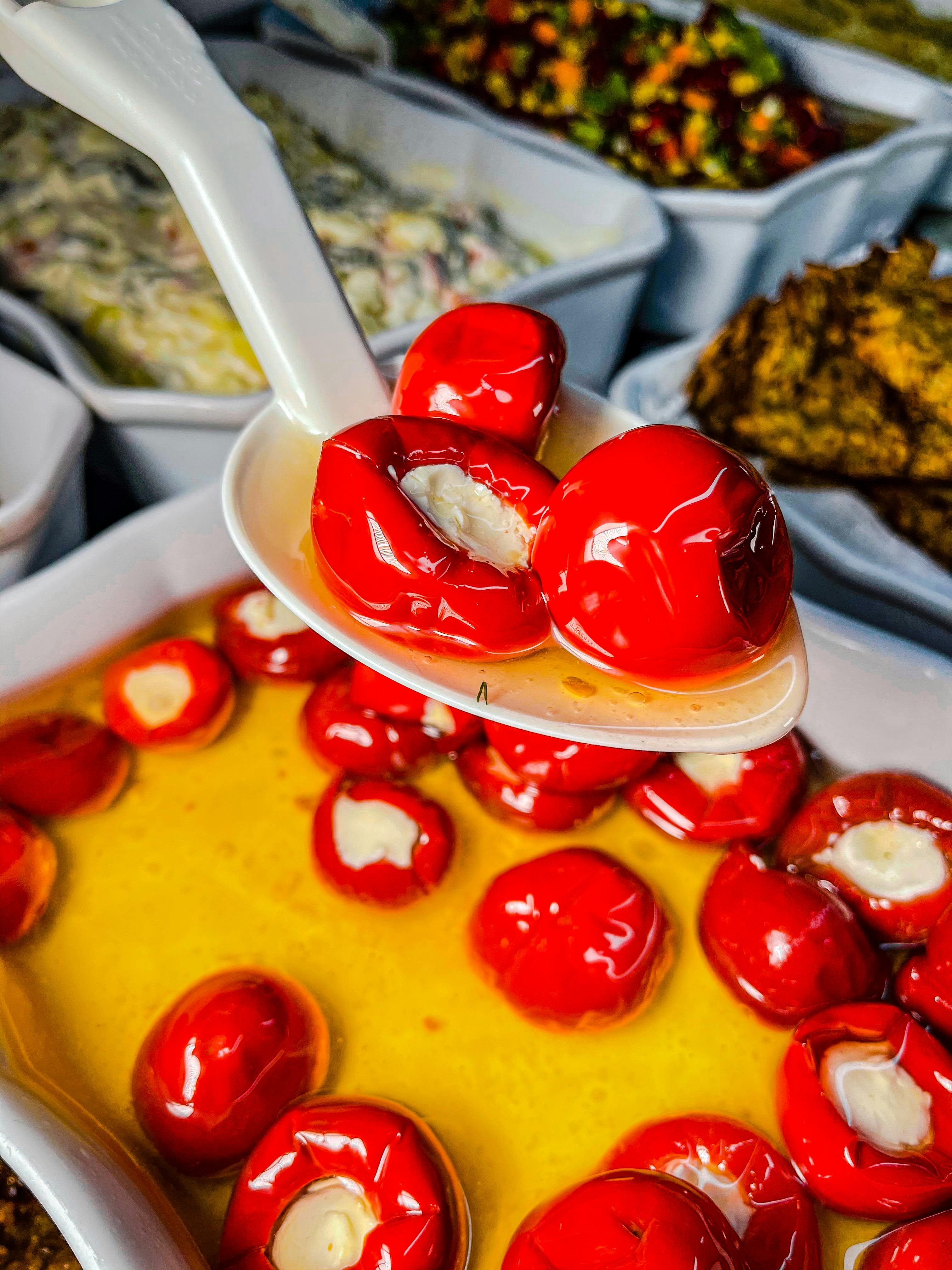 Jar of advanced pickled cherry peppers with spices