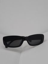 Black rectangular sunglasses on a pale surface — Viany J. Jimenez on Pexels