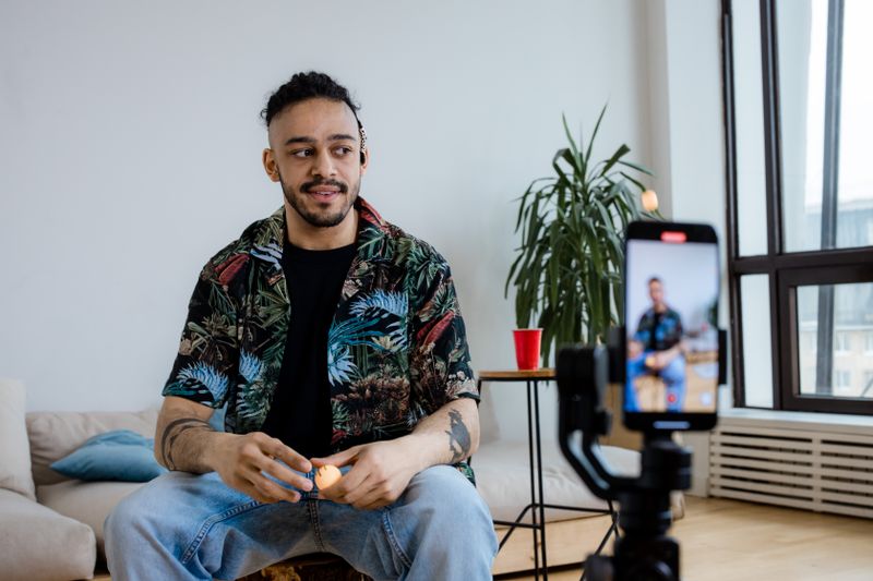 Small business owner filming video content on a smartphone