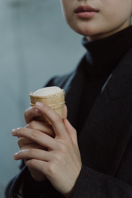 Person Holding Brown Ice Cream Cone