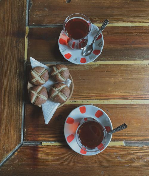 Free Top view of Turkish tea and pastries served on a traditional wooden table in Istanbul. Stock Photo