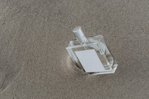 A Perfume Bottle on the Sand