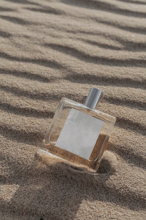 Square Glass Perfume Bottle on White Sand