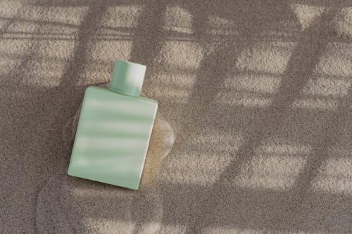 Perfume Bottle on the Sand