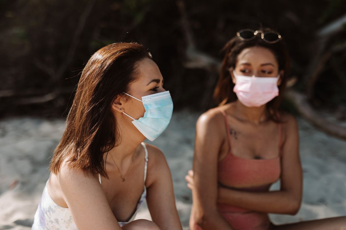 Free Women in Bikini Wearing Facemasks Stock Photo