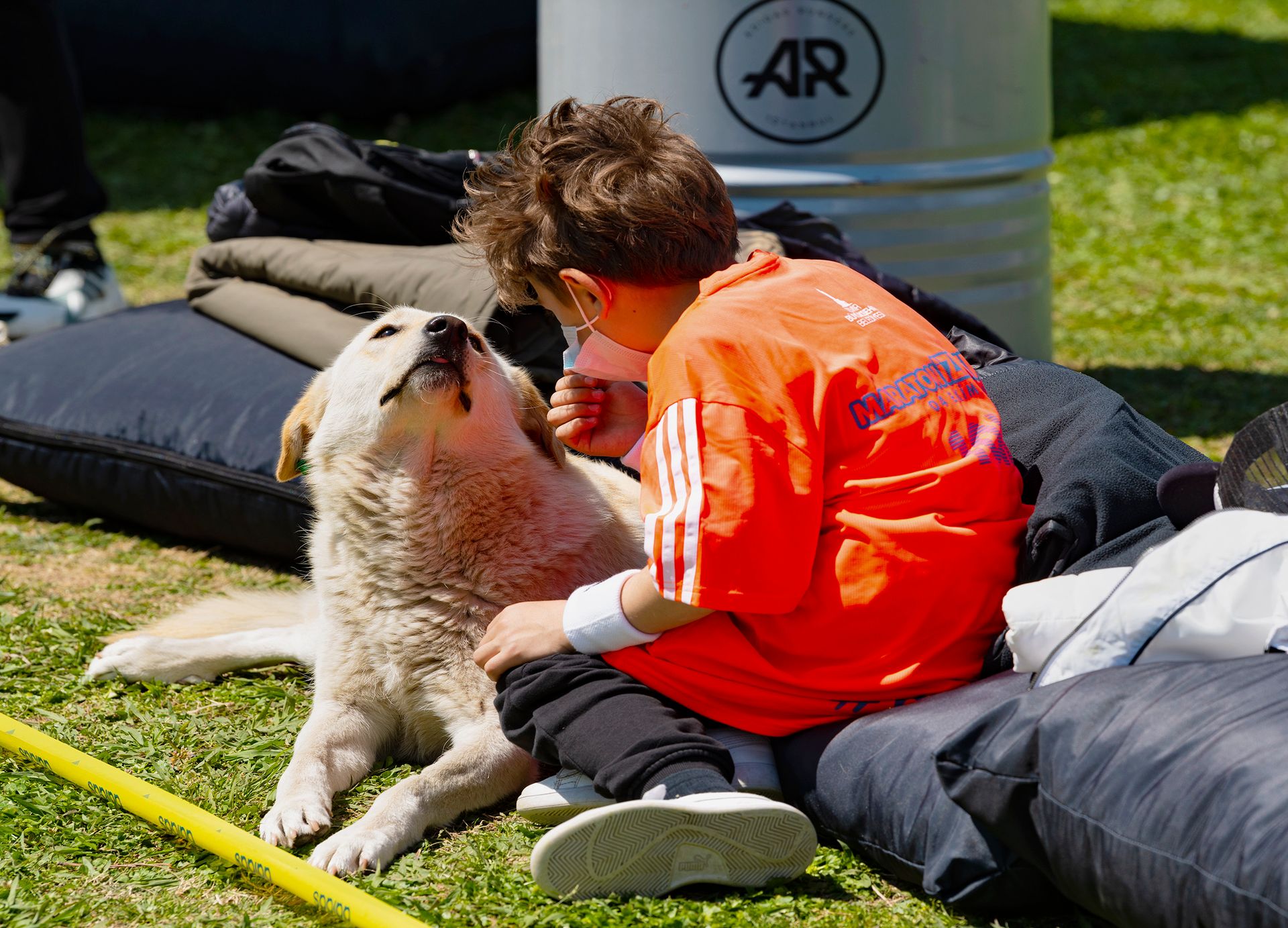 A Boy Sitting with His Pet Dog