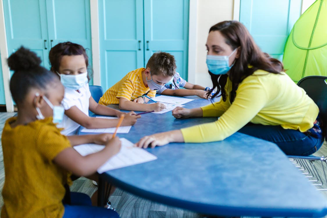 Free Teacher Teaching Her Students Stock Photo