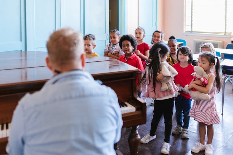 Children Standing Inside Room