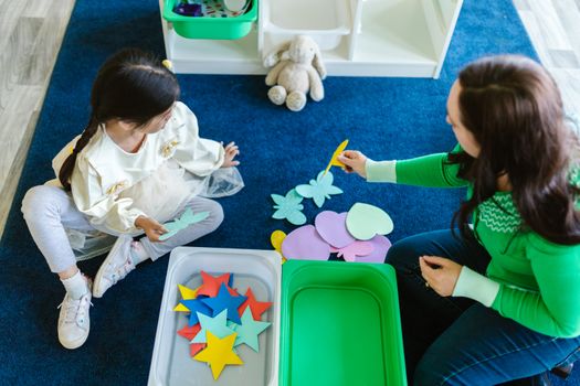 therapist and child playing
