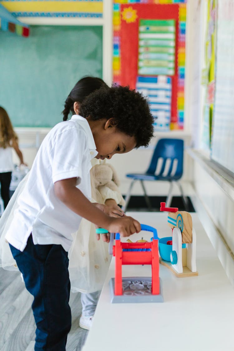 Children Playing With Their Toys Inside The School