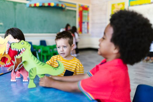 Kids enjoying playtime with dinosaur cutouts in a vibrant classroom setting.