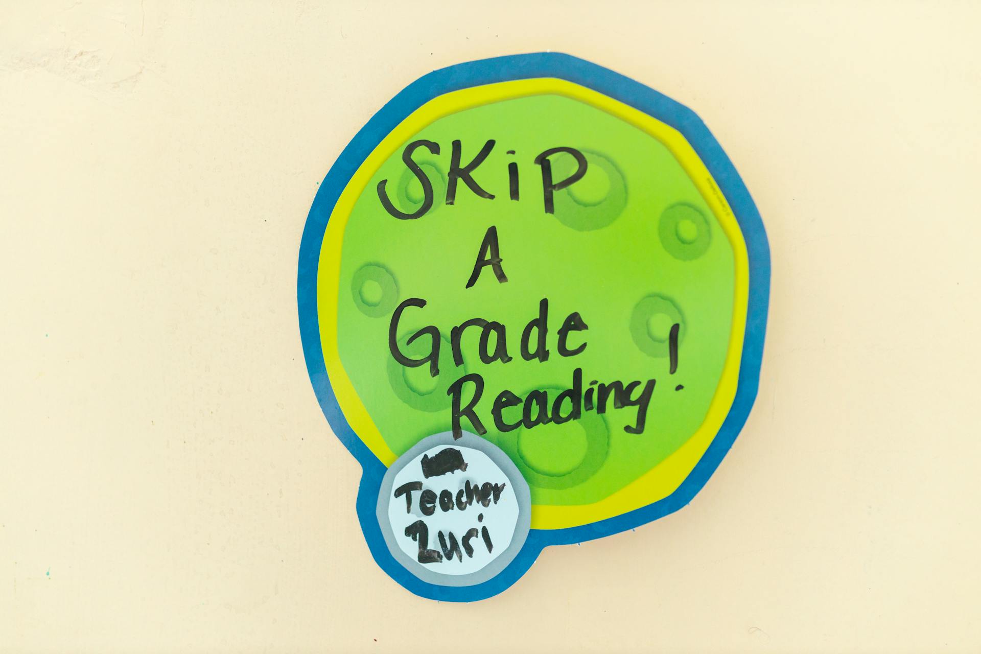 Colorful sign with 'Skip a Grade Reading' promoting educational advancement.