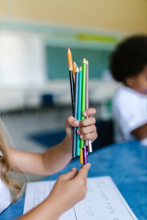 Kid Holding Color Pencils