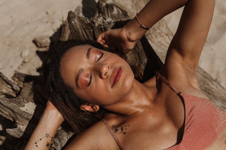 Woman Relaxing On Beach